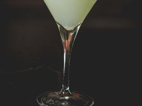 a martini glass with a green drink in it at ibis Santiago Las Condes in Santiago
