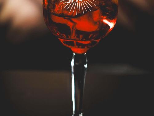 a wine glass filled with red wine at ibis Santiago Las Condes in Santiago