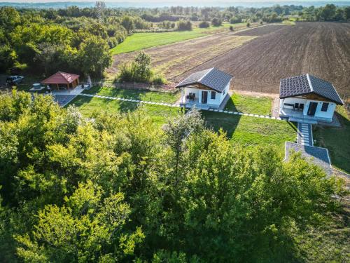 an aerial view of two houses in a field at Sunny Apartments in Malo Laole
