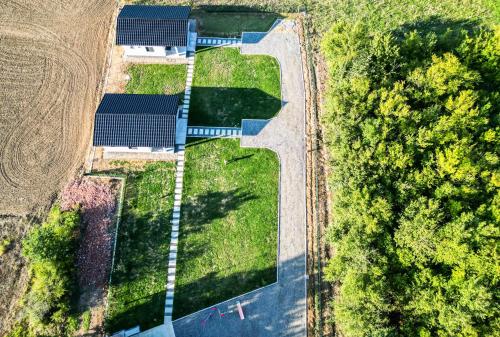 an aerial view of a field and a road at Sunny Apartments in Malo Laole