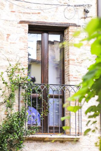 a window in a brick building with a gate at Residenza Sant'Andrea in Campobasso