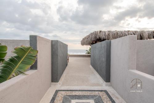 a hallway leading to the beach from a villa at Spectacular House with a Private Beach Front in Ixtapa-Zihuatanejo International