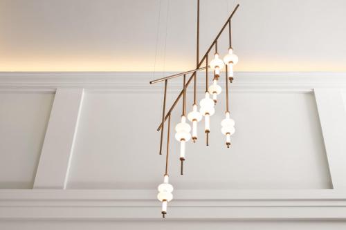 a chandelier hanging from a ceiling in a room at Kimpton Hotel Monaco Seattle by IHG in Seattle