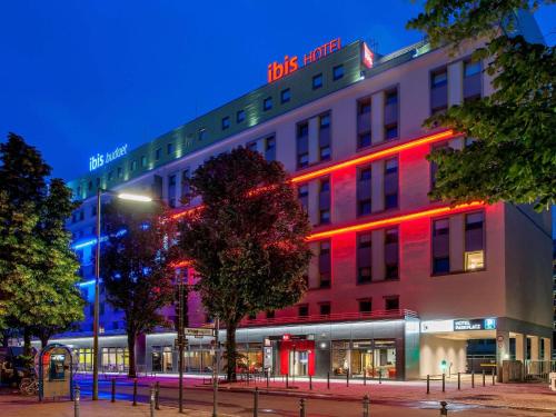 a building with red lights on the side of it at ibis budget Berlin Kurfürstendamm - neu renoviert in Berlin