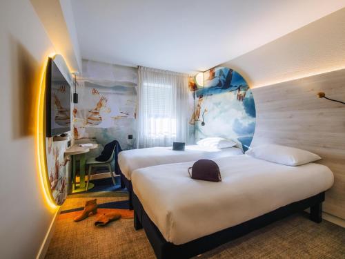 Cama o camas de una habitación en ibis Styles Antibes