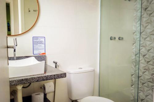 a bathroom with a toilet and a sink and a shower at VELINN Pousada Angra Sunset in Angra dos Reis