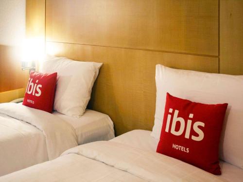 Ένα ή περισσότερα κρεβάτια σε δωμάτιο στο ibis Ambassador Seoul Insadong-Newly renovated in 2025