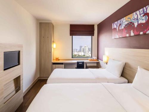 Кровать или кровати в номере ibis Bangkok Siam