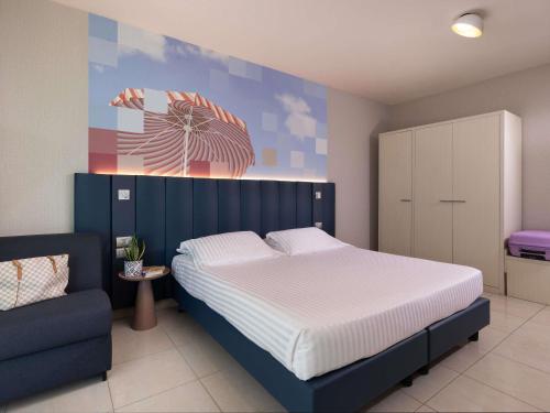 Postel nebo postele na pokoji v ubytování Mercure Hotel Rimini Artis