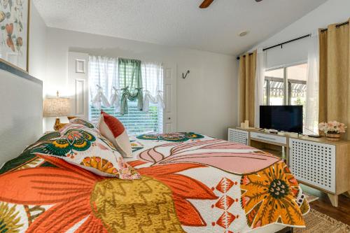 a bedroom with a large bed and a television at Private Pool and Golf Cart! Villa By Spanish Springs in The Villages