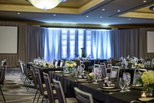 a banquet hall with tables and chairs with tablesearcher at Renaissance Phoenix Downtown Hotel in Phoenix