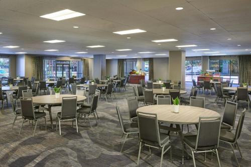 a dining room with tables and chairs in a building at Renaissance Phoenix Downtown Hotel in Phoenix