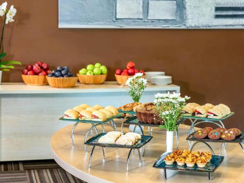 a buffet with three tiers of bread and pastries at ibis Adana in Adana