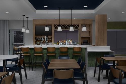 a rendering of a restaurant with tables and a bar at Fairfield Inn & Suites Fort Lauderdale Airport & Cruise Port in Dania Beach