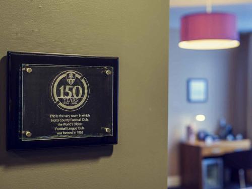 a sign on a wall in a room at Mercure Nottingham City Centre Hotel in Nottingham