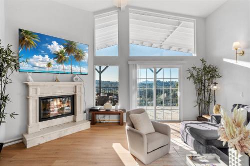 a living room with a couch and a fireplace at Entire Private 4BR 2Bth, Pool, View, 4 Parking, King Bed, Big Yard in El Cajon