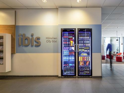 a soda vending machine in a store with drinks at ibis München City Süd in Munich