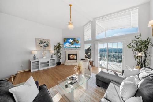a living room with a couch and a glass table at Entire Private 4BR 2Bth, Pool, View, 4 Parking, King Bed, Big Yard in El Cajon