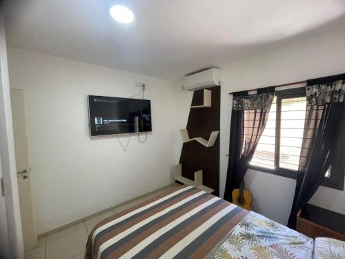 TV a/nebo společenská místnost v ubytování Departamentos frente al shopping