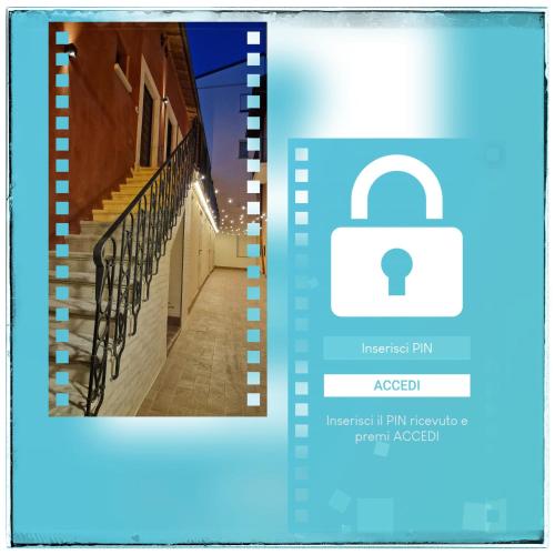 a padlock on a staircase next to a building at Vagabondando travel house in LʼAquila