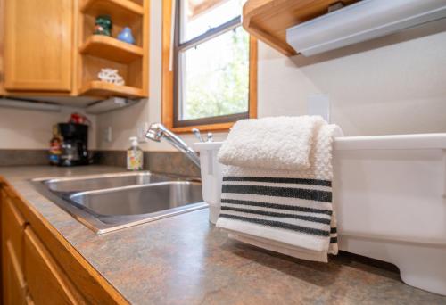 a kitchen with a sink and a towel on the counter at Remodeled Family Retreat 15ppl in Page