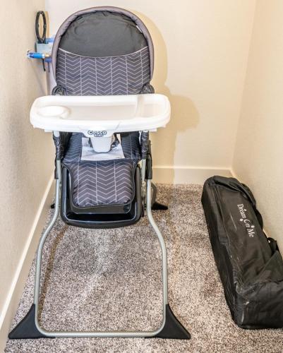 a high chair in a room with a bag at Remodeled Family Retreat 15ppl in Page