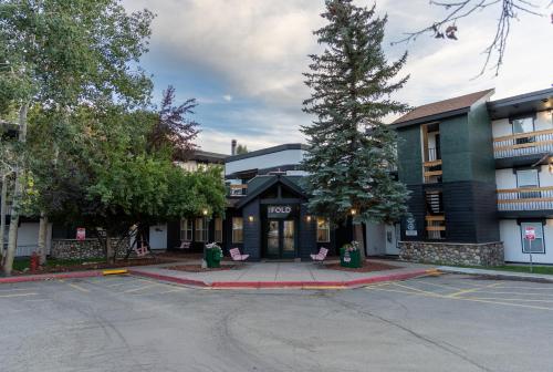 an empty parking lot in front of a building at The Fold Hotels Steamboat Springs in Steamboat Springs