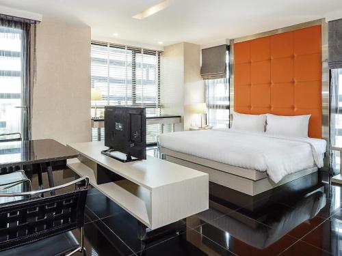 Ein Bett oder Betten in einem Zimmer der Unterkunft ibis Styles Chiang Mai