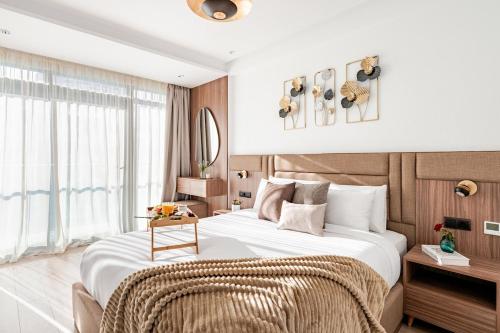 a bedroom with a large bed and a window at Modern Luxury Oasis in Tangier