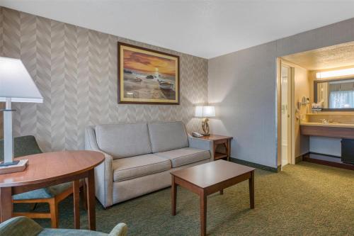 a living room with a couch and a table at Best Western Seven Seas in San Diego