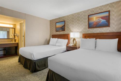 a hotel room with two beds and a window at Best Western Seven Seas in San Diego