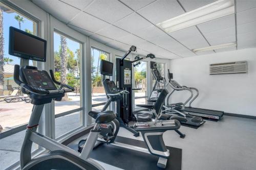 a gym with treadmills and cardio machines at Best Western Seven Seas in San Diego