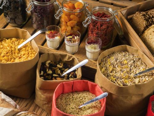 a table topped with containers of different types of food at ibis De Panne in De Panne
