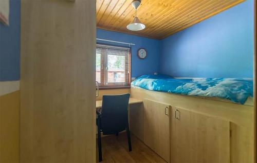 a bedroom with a bed and a desk and a chair at Stunning Home In Erm With Sauna in Erm
