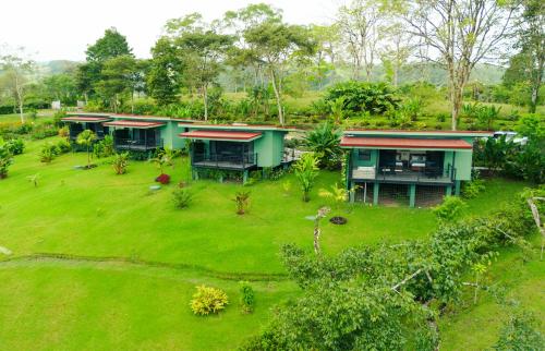 an aerial view of a house with a yard at Cabañas Vista Verde opción con jacuzzi in San Vito