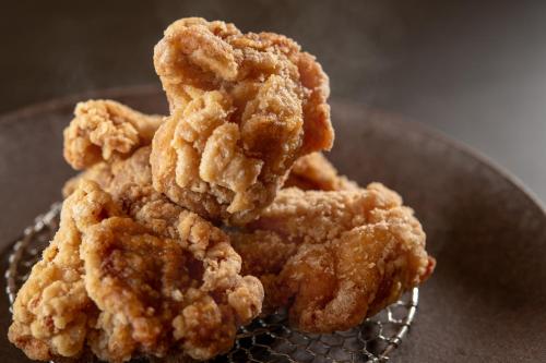 a pile of fried food sitting on a plate at Kirishima Kokusai Hotel in Kirishima