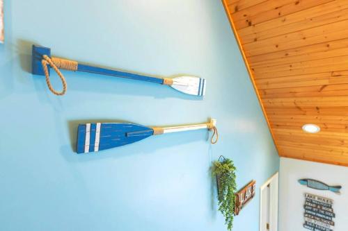 a room with two baseball bats on the wall at Relaxing Lakefront Retreat w/ Hot Tub & Dock in Blountville