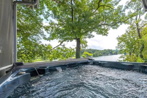 a water slide in the middle of a river at Relaxing Lakefront Retreat w/ Hot Tub & Dock in Blountville