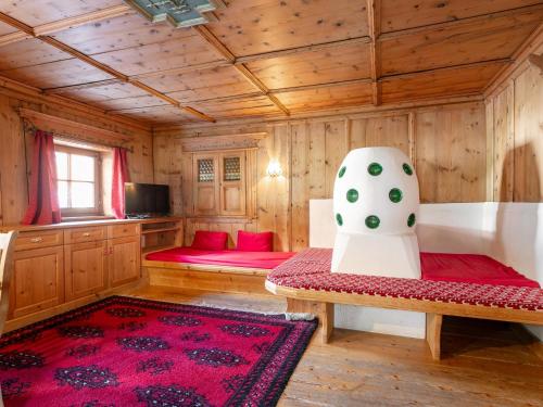 a living room with a couch and a chair at Schweizerhof Margrith in Huben