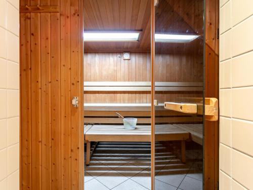 a sauna with a bench in a room at Schweizerhof Margrith in Huben