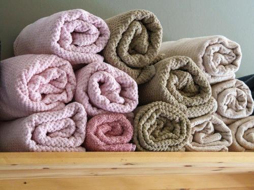 a pile of towels sitting on top of a table at Billie in Weerselo