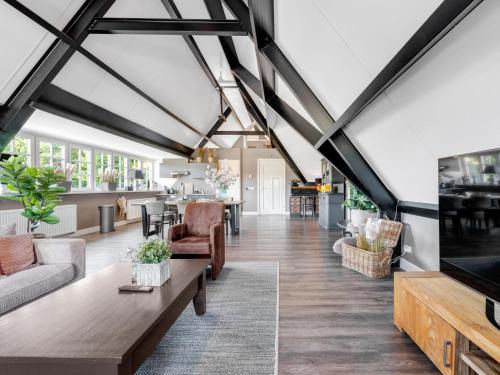 an open living room with a vaulted ceiling at Billie in Weerselo