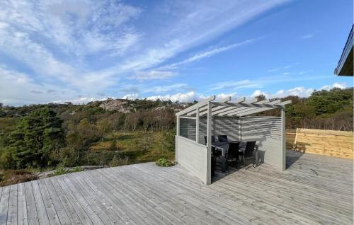 a building on top of a wooden deck at 4 Bedroom Lovely Home In Lindesnes in Ramsland