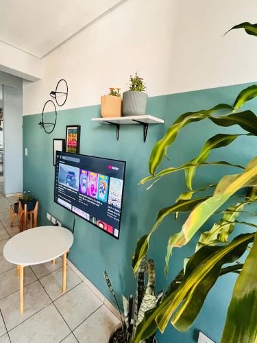 a room with a computer monitor on a wall at Altos de Barrio Sur in San Miguel de Tucumán