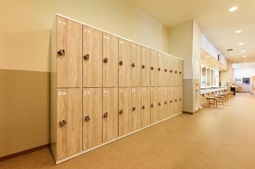 a row of lockers in a room with a hallway at Oehonke in Kitami