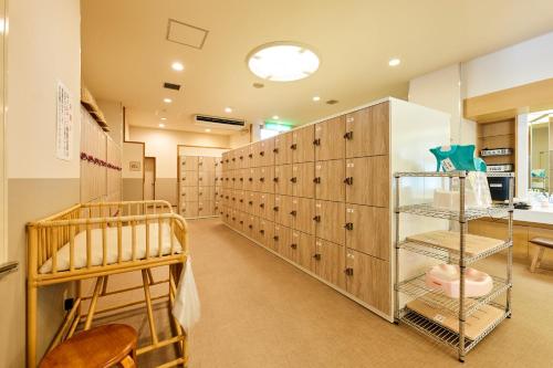 a room with a closet with lockers at Oehonke in Kitami