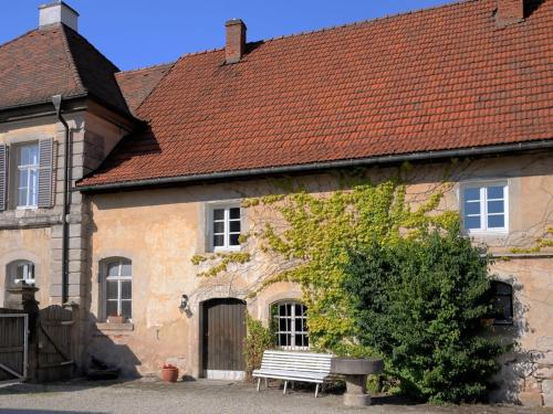 a building with a bench in front of it at Holiday home with 4 bedrooms in Maroldsweisach