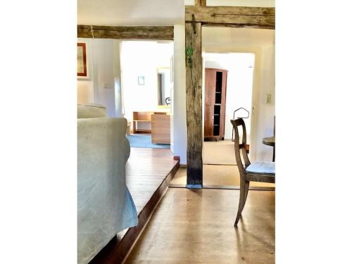 a living room with a couch and a chair at Holiday home with 4 bedrooms in Maroldsweisach
