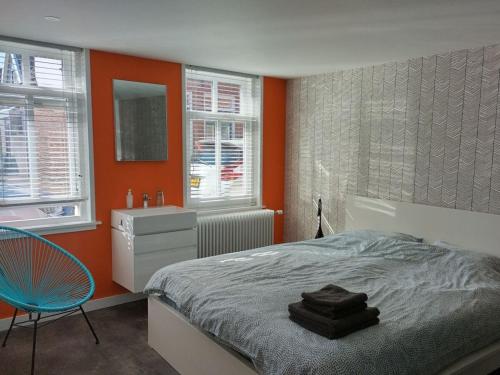 Postel nebo postele na pokoji v ubytování Centraal aan Zee