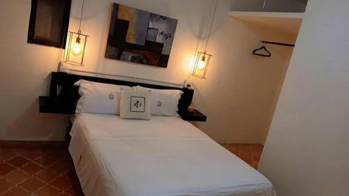 a bedroom with a bed with a picture on it at apartamento Ileana in Bandita